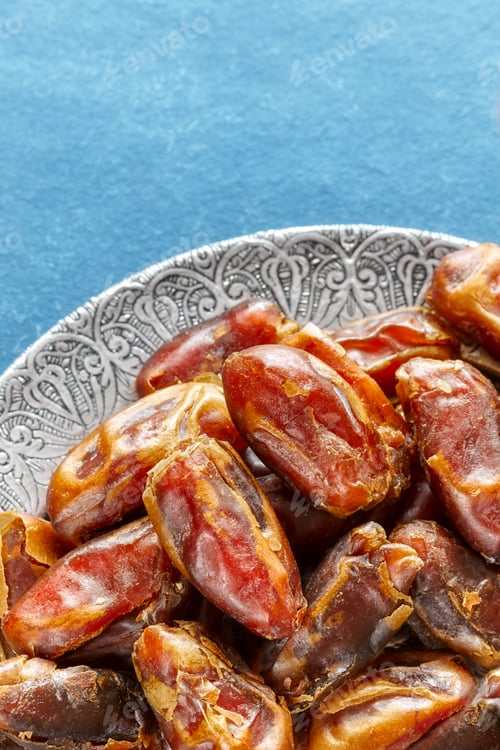 Preview: Sweet dried dates on a plate.