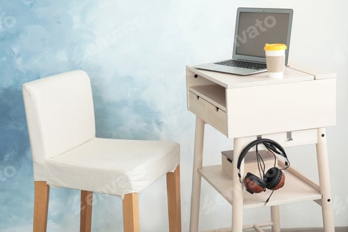 Preview: High wooden table with laptop as stand up workplace in modern interior