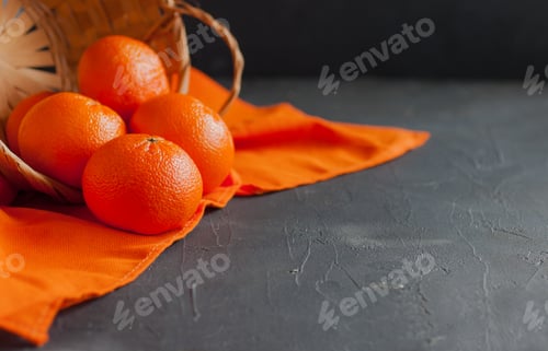 Preview: Tangerines spilled out of the basket.