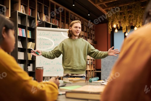 Preview: Young Man Teaching Multiethnic Students in Modern Library