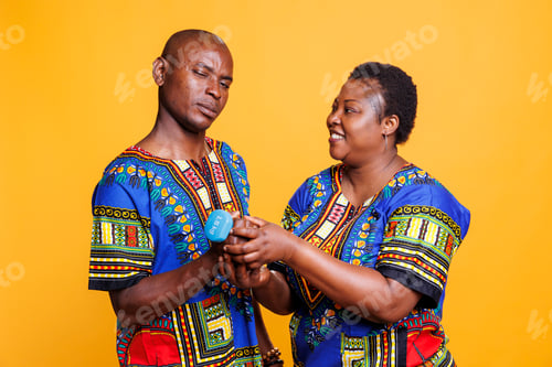 Preview: Woman giving dumbbell to boyfriend