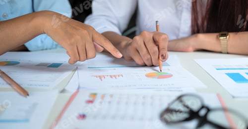 Preview: Close up hands of two colleagues discussing with document data and calculator on desk table. Close