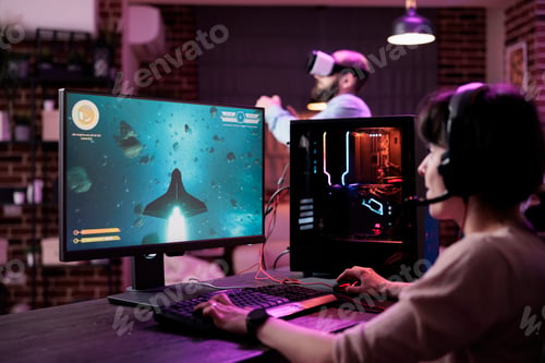 Preview: Young adult playing shooter video games championship on pc