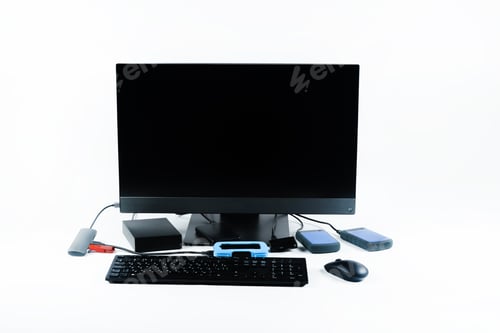 Preview: Multiple external hard drives connected to a monoblock on a white background.Computer with hard