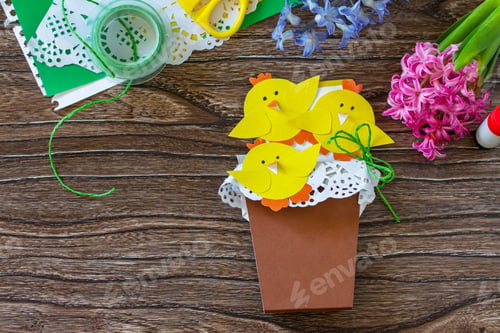 Preview: Gift postcard happy easter chickens toy on a wooden table. Handmade.