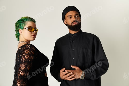 Preview: Stylish multicultural couple showcases trendy sunglasses in a studio setting