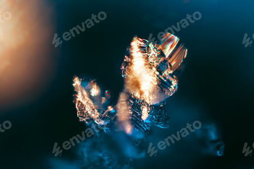 Preview: Macro shot of icy frost with colorful lighting shining from it