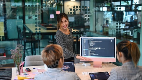Preview: Team of IT programmers talking, discussing plan for new project together at modern office.