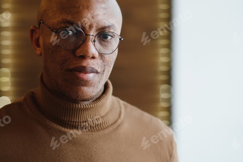 Preview: Man in Turtleneck and Glasses Studio Close-Up
