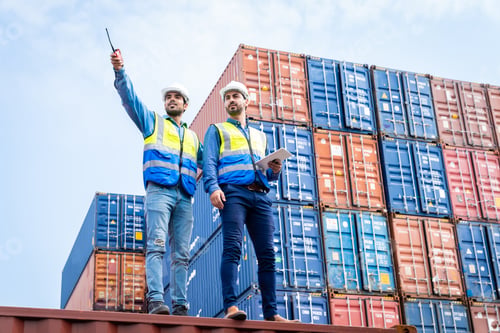 Preview: Two male engineers in a container shipping company