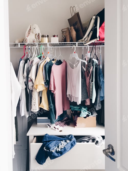 Preview: Organized Clothing in Closet with Drawer