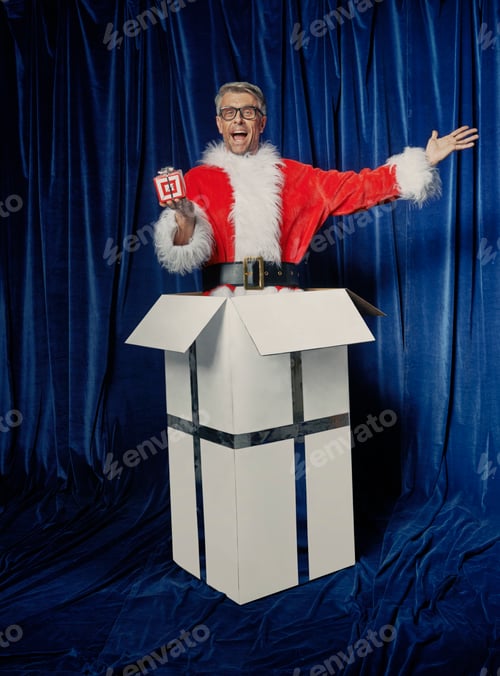 Preview: Santa in box with Christmas gift