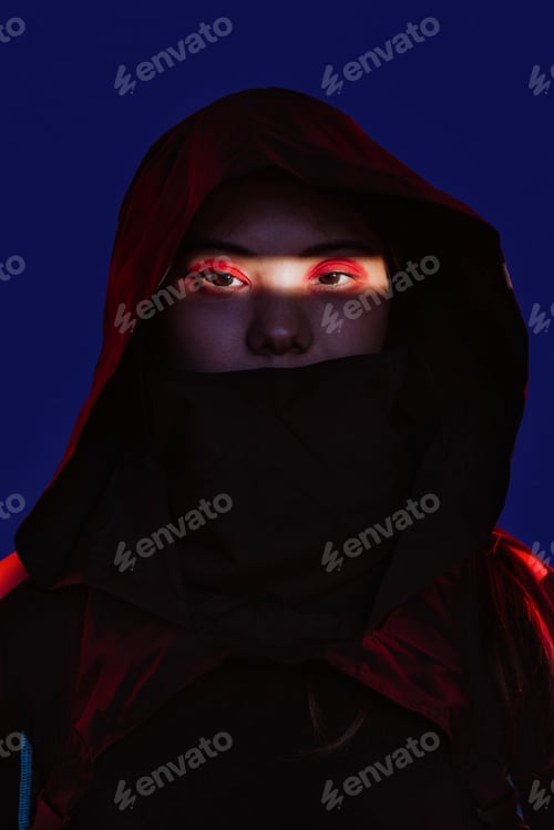Preview: Woman in hooded cloak with glowing red eyes