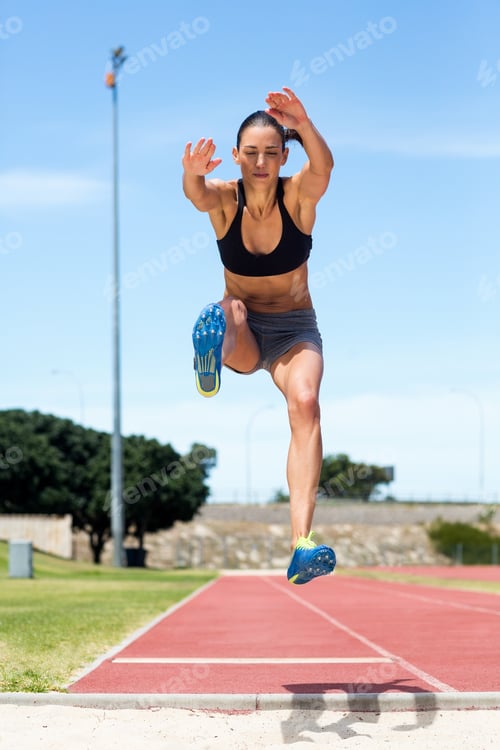 Preview: Female athlete performing a long jump
