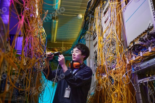 Preview: Technician Inspecting Server Room