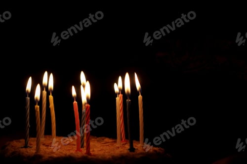 Preview: On A Black Background A Napoleon Cake With Candles
