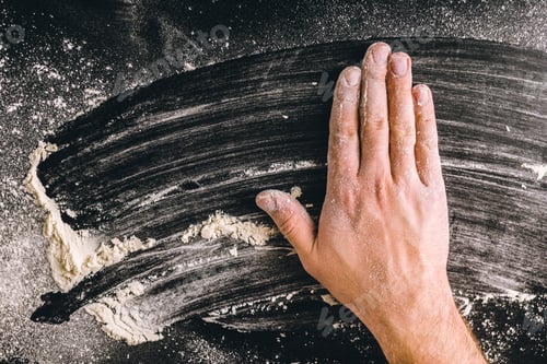 Preview: adult man hands work with flour, dark photo