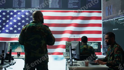 Preview: Team of military experts operates high tech computers and tablet