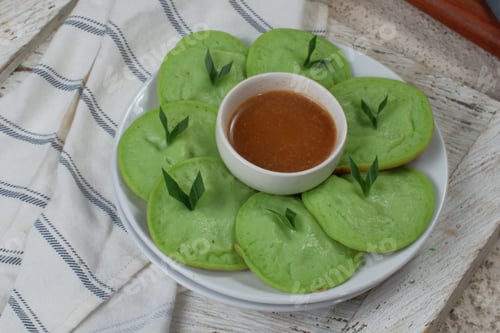 Preview: serabi or surabi - indonesian pancake,made from rice flour, coconut milk and served with brown sugar