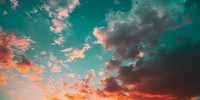 Preview: Sunset Sunrise Sky Background. Bright Dramatic Sky In Yellow, Orange And Blue Colors.