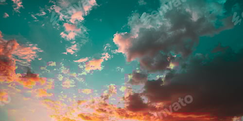 Preview: Sunset Sunrise Sky Background. Bright Dramatic Sky In Yellow, Orange And Blue Colors.