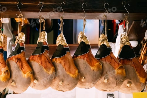 Preview: Hanging Italian Dry-cured Ham Prosciutto In Shop. Italian Cuisine