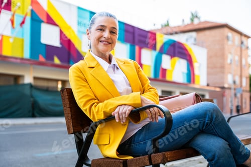 Preview: Senior businesswoman wearing business casual attire in the city
