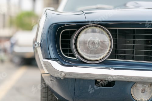 Preview: Close up of vintage old car with faded color and rust on the side