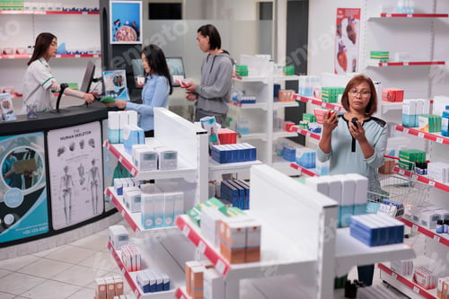 Preview: Asian client analyzing boxes and bottles