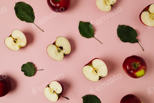 Preview: Red apple, half apple and quarter apple on pink background. Top view, healthy food concept. Top view