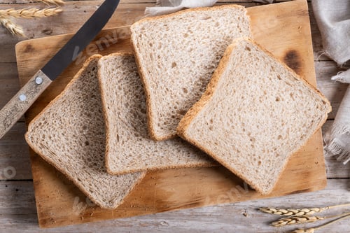 Preview: Healthy wholemeal bread slices on wooden table