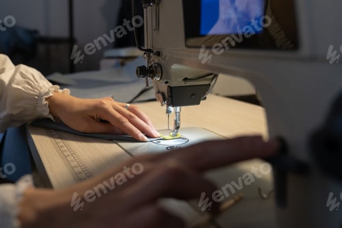Preview: Seamstress work on sewing machine, closeup. Woman fashion designer create new clothes collection