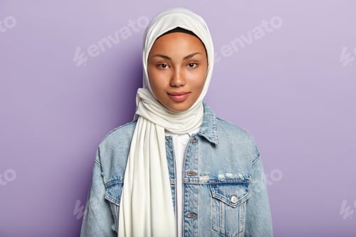 Preview: Smiling Woman in White Head Covering and Denim