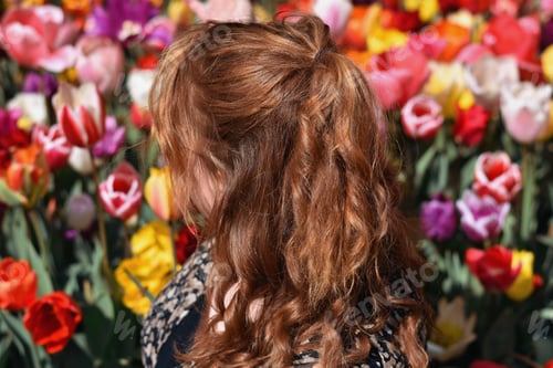 Preview: Woman in front of field of tulips