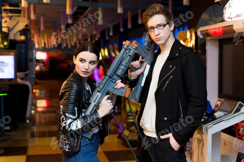 Preview: Man and a woman playing on slot machines, attractions in the Mall