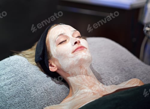 Preview: Its a deep moisturizing. A young woman getting a facial at a spa.