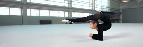 Preview: Gymnast in Flexibility Pose Wide Banner with Copy Space
