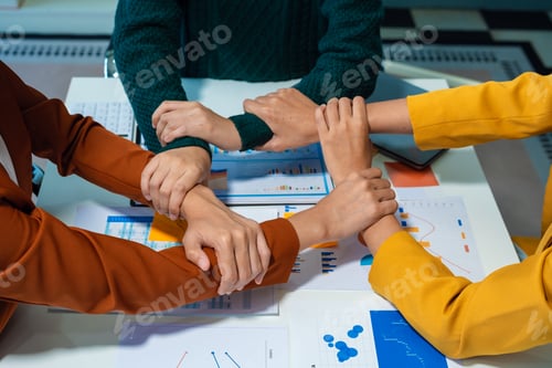 Preview: Close up business people holding each others wrists, join hands together