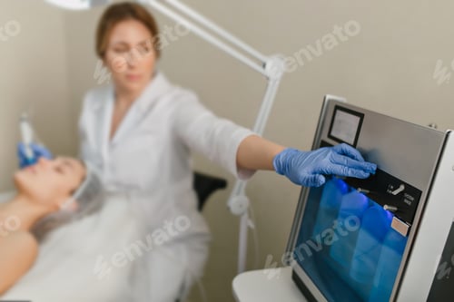 Preview: Doctor cosmetologist in blue gloves doing botox therapy in beauty salon. Professional dermatology pr