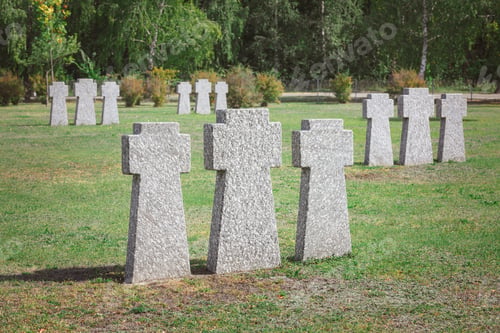 Preview: graveyard with identical old memorial headstones placed in rows