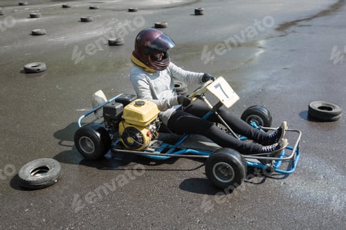 Preview: Karting - driver in helmet on kart circuit