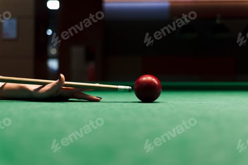 Preview: Close up at the girl aiming a cue ball on a ball in a pool table