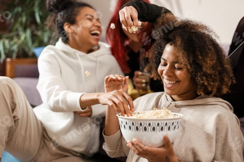 Preview: Three happy multiethnic women friends