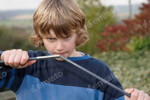 Preview: Boy erecting tent poles