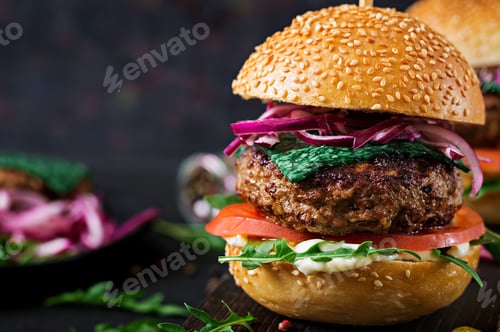 Preview: Big sandwich - hamburger burger with beef, tomato, basil cheese and arugula.