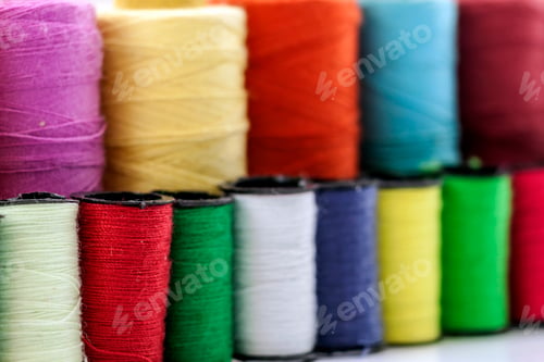 Preview: Reels or spools of multicolored sewing threads. Threads of all colors.