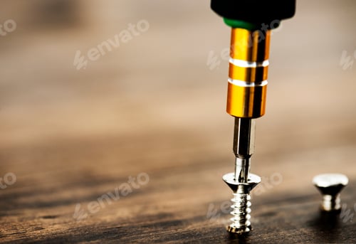 Preview: Macro shot of screw on wooden background