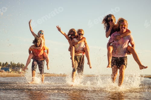 Preview: three young men giving their girlfriends piggyback rides