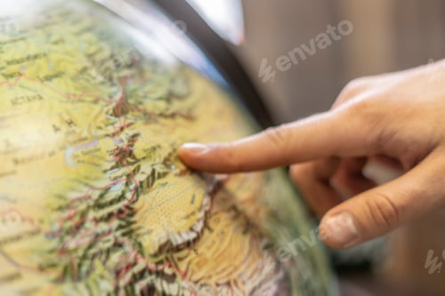 Preview: persons finger point at globe and choose destination b