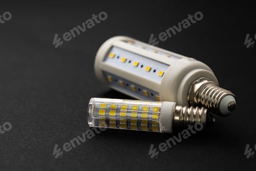 Preview: Compact light bulb isolated on black background